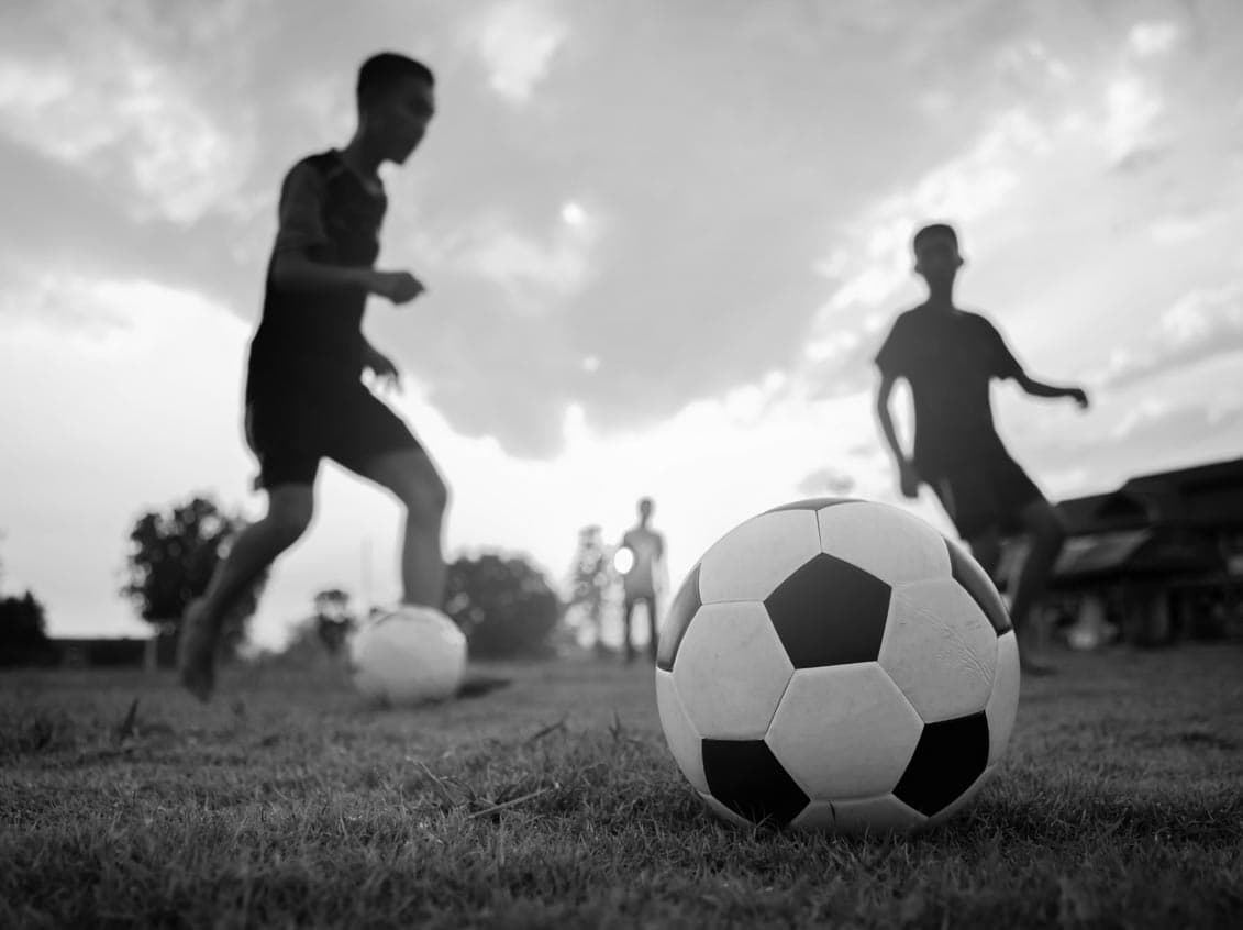 People playing with soccer balls